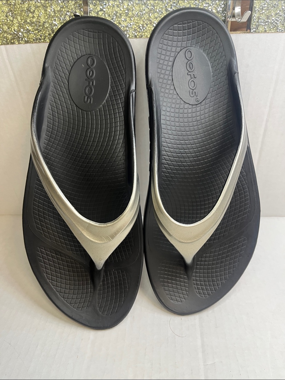 OOFOS Women's Black Flip Flop Sandals with Metallic Silver Straps - Picture 8 of 12